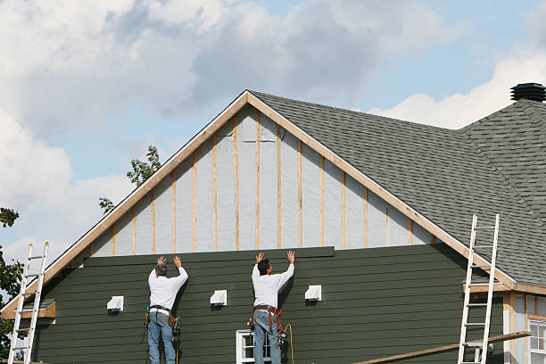 Professional Emergency Siding Repair technician working in Trenton, IL